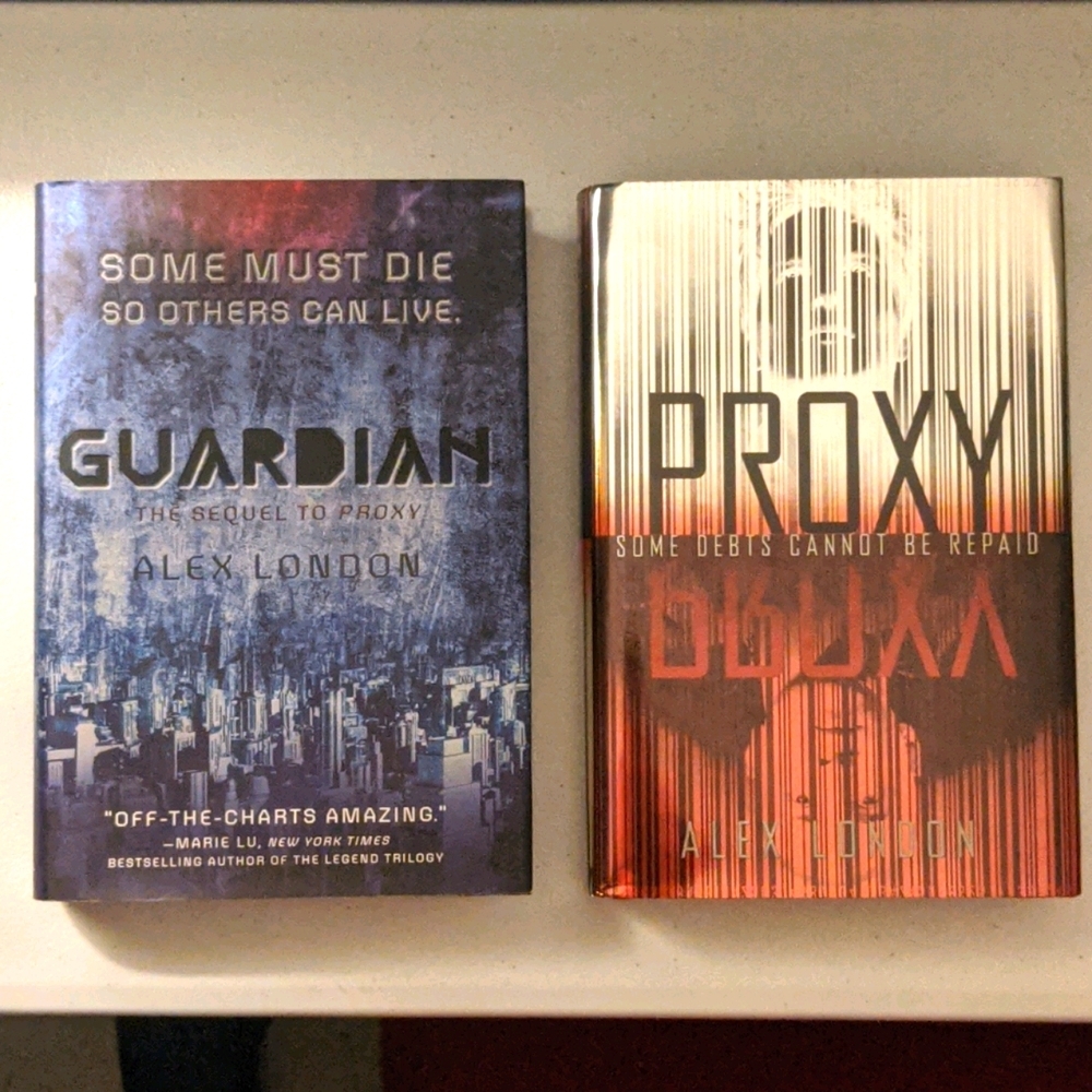 Pair of Alex London Hard Cover Novels